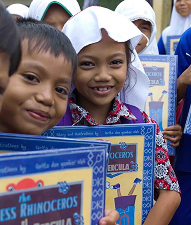 Children with rhino book