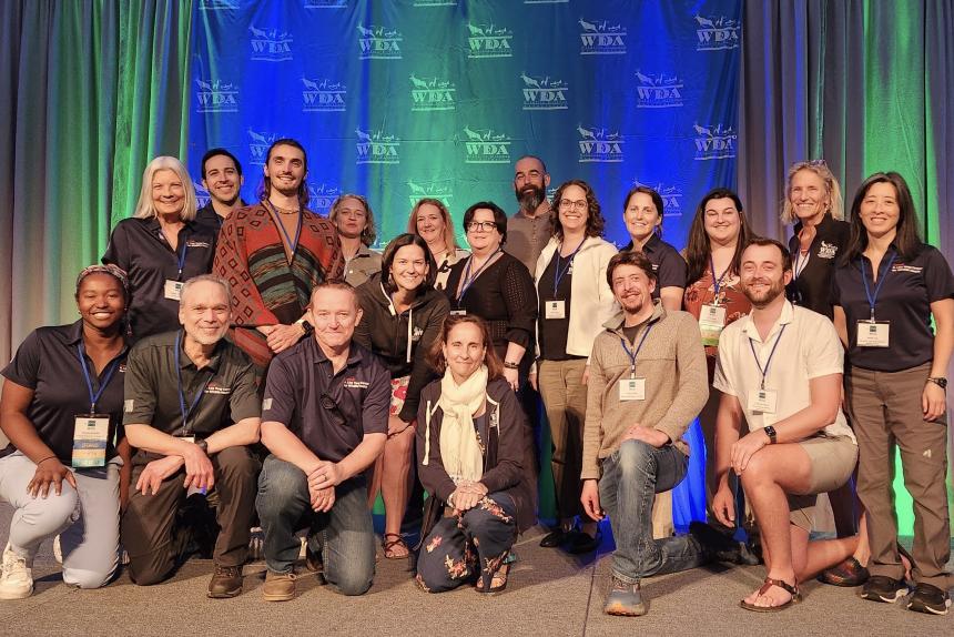 Group of faculty, staff, alumni, and students at the 2025 Wildlife Disease Association conference